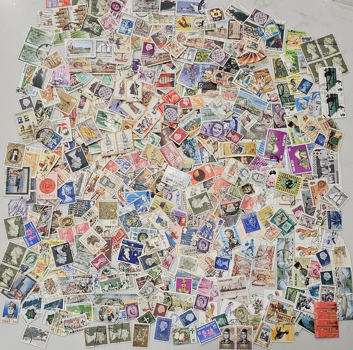 Collection of 400 PC's International unexamined stamps from a large collect