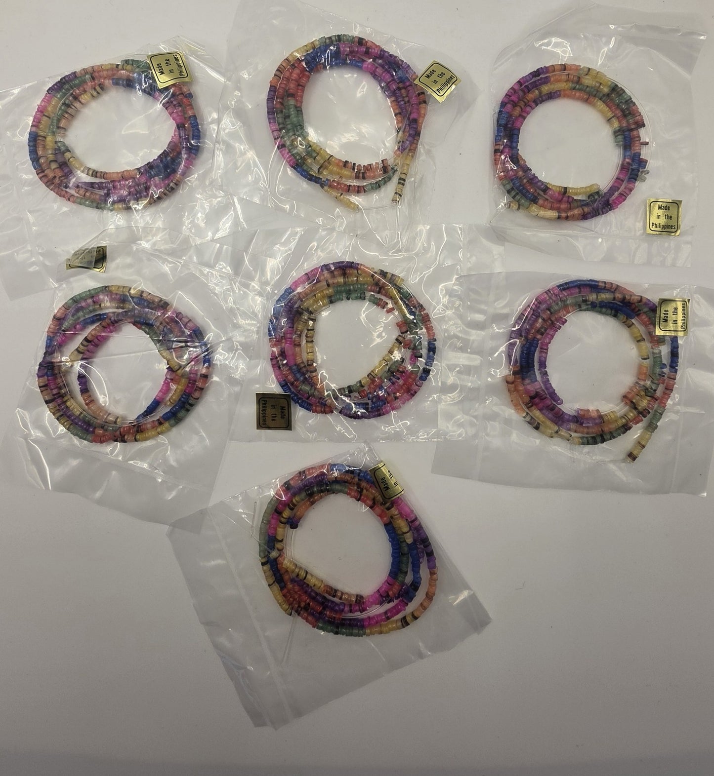 Lot of 7 Vintage Rainbow Heishe Shell Bead Necklaces Made in Philippines NOS