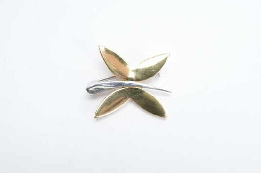 An Italian dragonfly brooch in 18 carat yellow and white gold. Measures 23.6x17