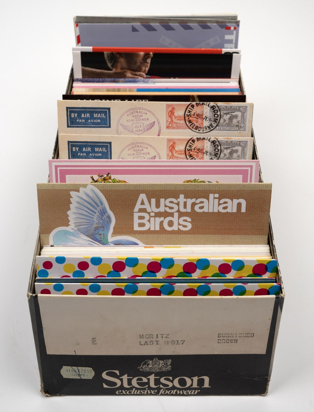A shoebox packed tightly with 1980s-90s 280 Mint stamp packs; FV $470+, highest