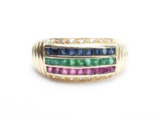 A ruby, sapphire, emerald and cubic zirconia ring in 14 carat yellow gold