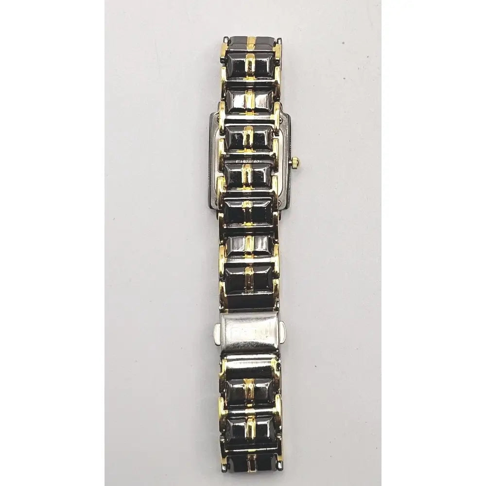A women's watch featuring a two-tone metal bracelet with black rectangular links bordered in gold and silver-toned links, shown against a plain light gray background.