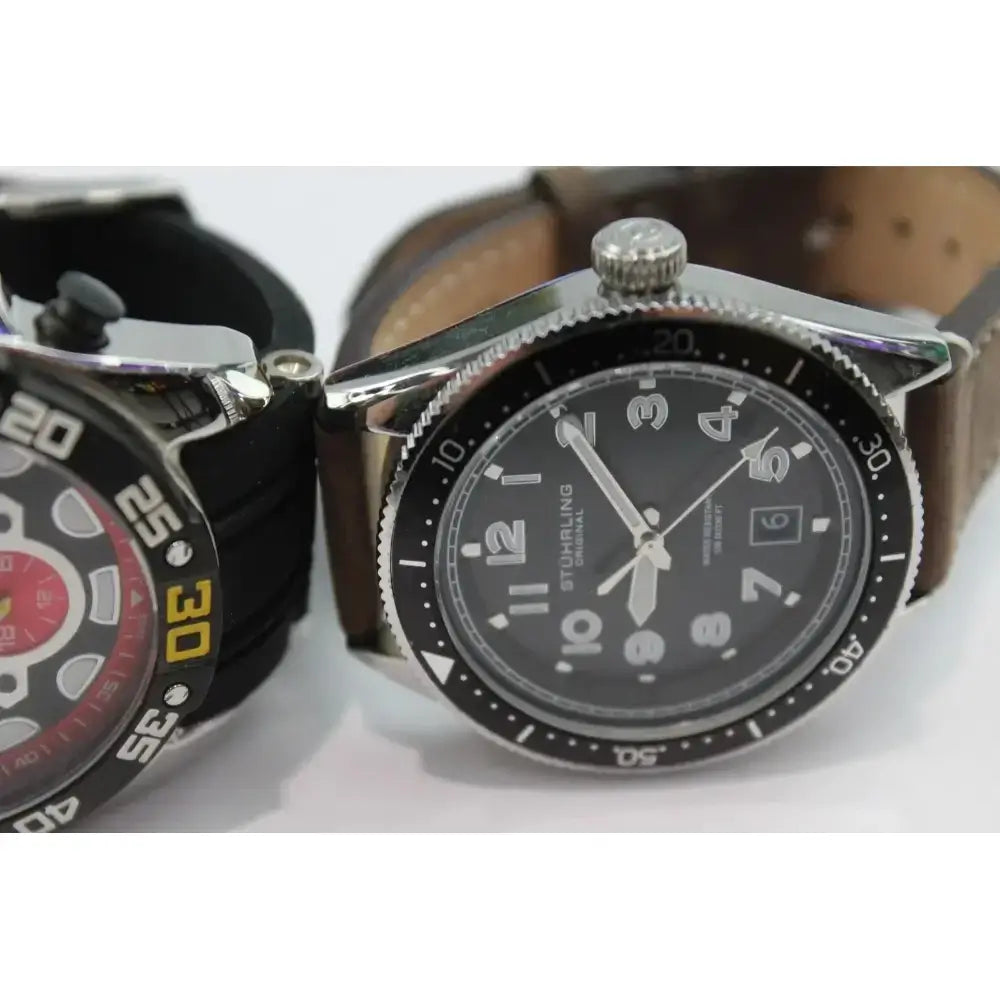 Stührling diver style watch black dial with tan leather strap

